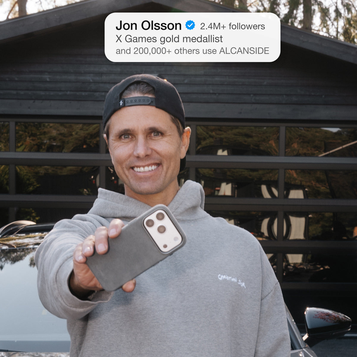 Jon Olsson holding the Nardo Gray ALCANSIDE Alcantara case